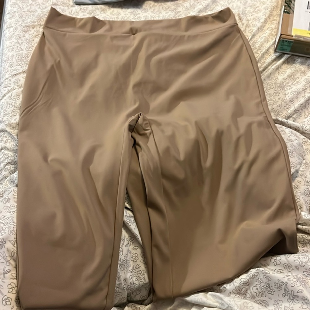 Long brown pants scrunch on butt.